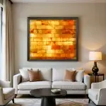 4x4 backlit Himalayan salt wall with warm amber glow in a living room of a home.